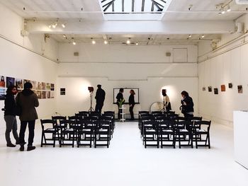 High angle view of people standing on floor