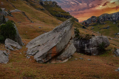 Scenic view of land against sky during sunset