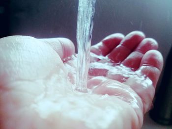 Close-up of hand with water