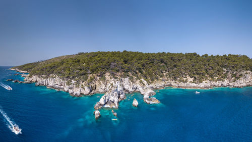 Scenic view of sea against clear blue sky