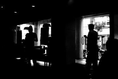 Silhouette people in dark background