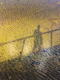 High angle view of shadow on sand