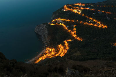 High angle view of illuminated mountain at night