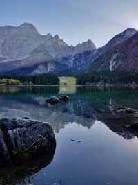 Scenic view of lake and mountains against sky