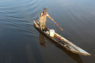 High angle view of man on boat in lake