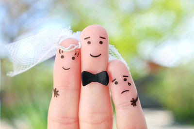 Fingers art of happy couple to get married. concept of stepson vs wedding.