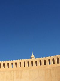 View of historical building against blue sky