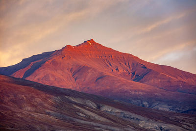 Scenic view of mountain against sky during sunset