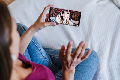 Midsection of woman on video call