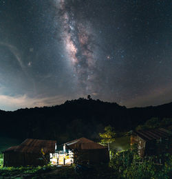 Scenic view of mountains against sky at night