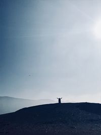 Mid distance of person on mountain against sky