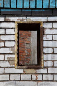 Low angle view of window on wall