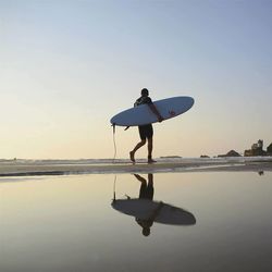 Silhouette of woman in sea