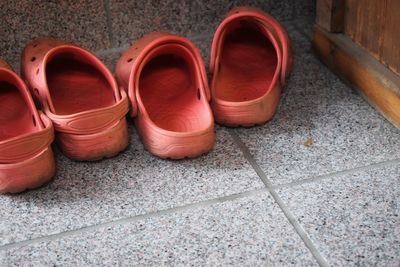 High angle view of shoes on tiled floor