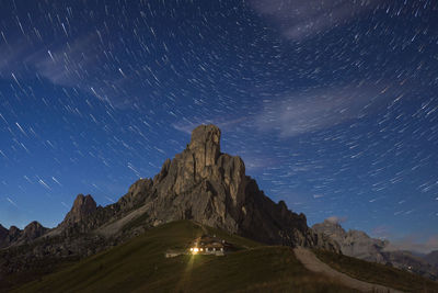 Scenic view of mountains against sky at night