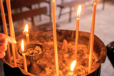 Close-up of illuminated tea light candles