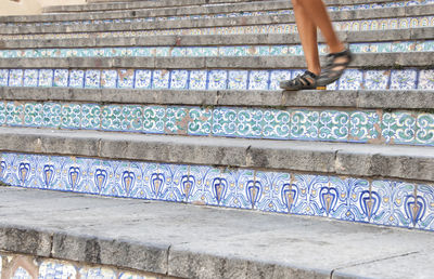 Low section of woman on steps