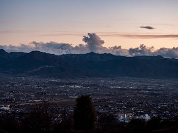 Scenic view of mountains against sky during sunset