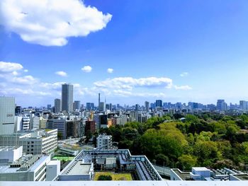 Modern buildings in city against sky