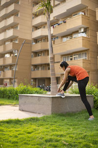 Side view of man standing on footpath