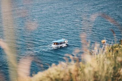 High angle view of ship sailing in sea