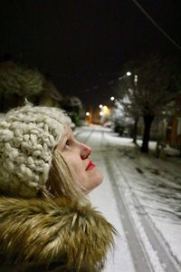 Close-up of snow on person at night