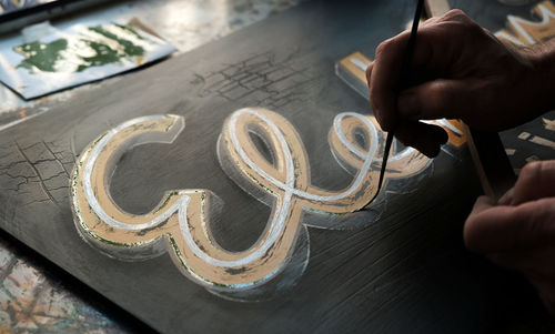 High angle view of person hand on table