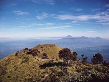 Scenic view of mountains against cloudy sky