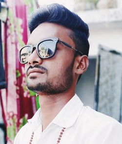 Portrait of young man wearing sunglasses