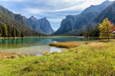 Scenic view of lake and mountains against sky