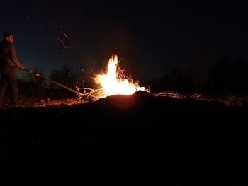 Bonfire on wooden structure at night