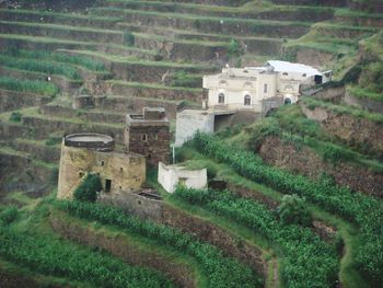 High angle view of buildings on field