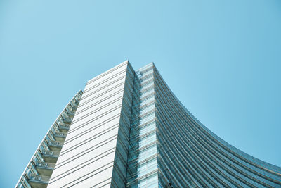 Low angle view of modern building against clear sky