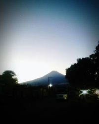 Silhouette landscape against clear sky