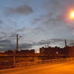 Road against cloudy sky at sunset