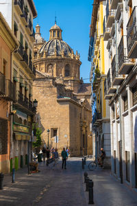 People walking on street in city