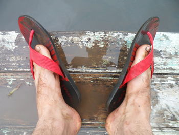 Low section of man on boat against sea