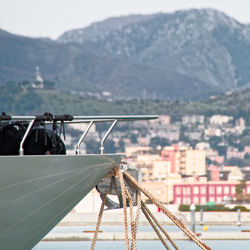 Cropped image of boat moored on lake