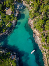 Aerial view of boats in beautiful sea bay, cala mitjana, mallorca, spain