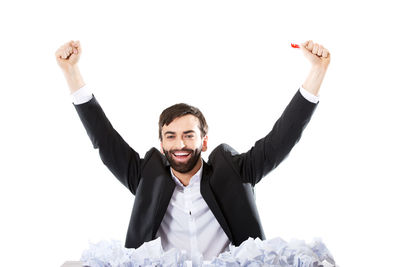 Portrait of young man against white background