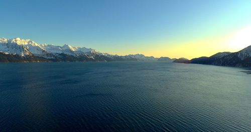 Scenic view of sea against clear sky during sunset