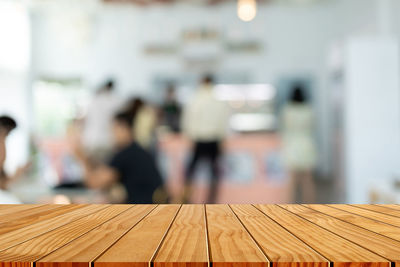 Close-up of people on table