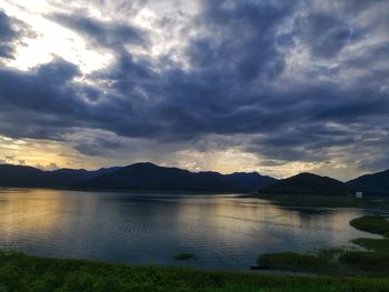 Scenic view of lake against sky during sunset