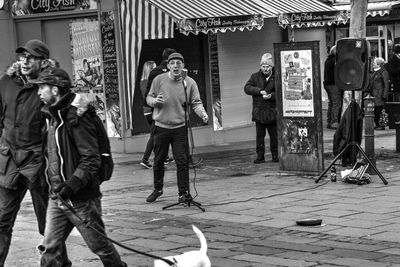 People standing on street in city