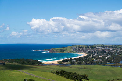 High angle view of city and sea against sky