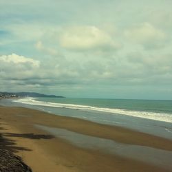 Scenic view of beach against sky