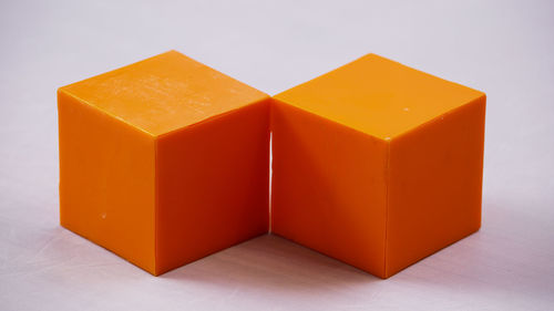 Close-up of orange over white background