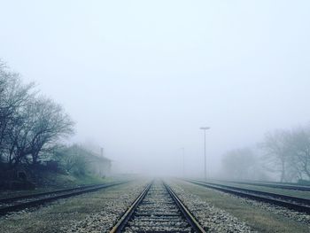 View of railway tracks in foggy weather