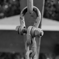 Close-up of metal chain against blurred background