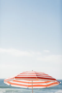 Umbrella against sky at beach